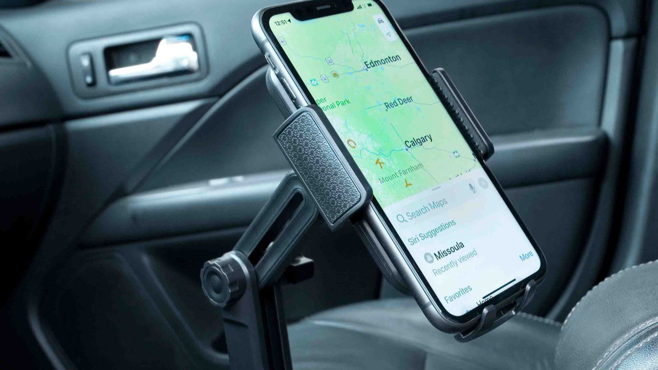 Adjustable cup holder phone mount from Cozy Cup Holder installed in car center console