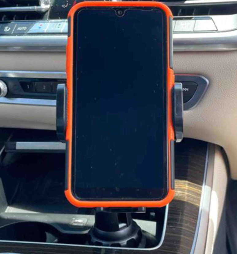 Adjustable car mount holding smartphone horizontally in center console